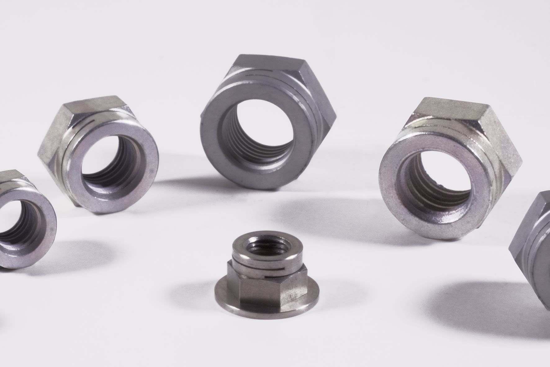 Manufacture of slotted self-locking nuts